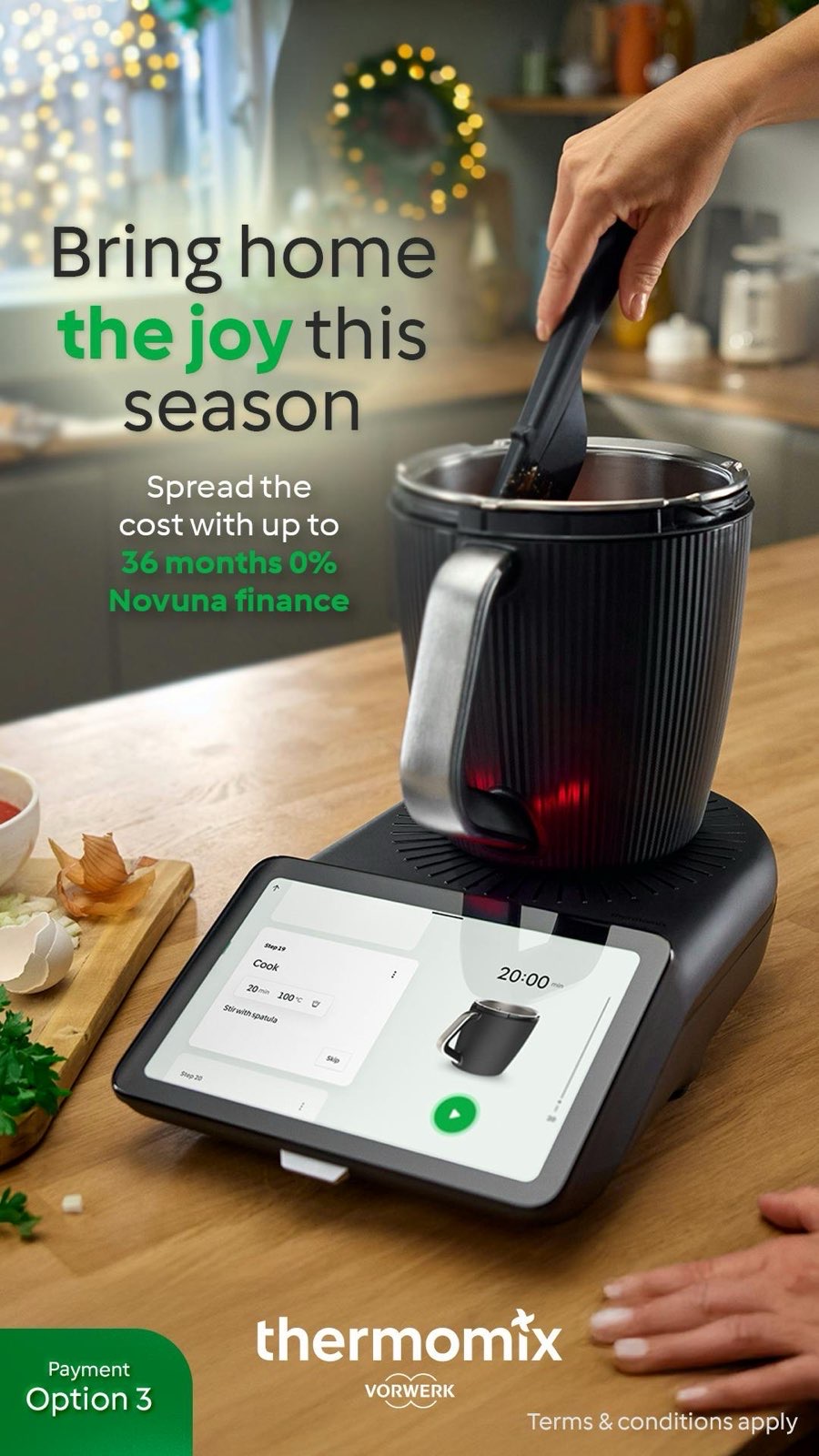 Thermomix® TM7 on a wooden worktop with Novuna finance option on the screen