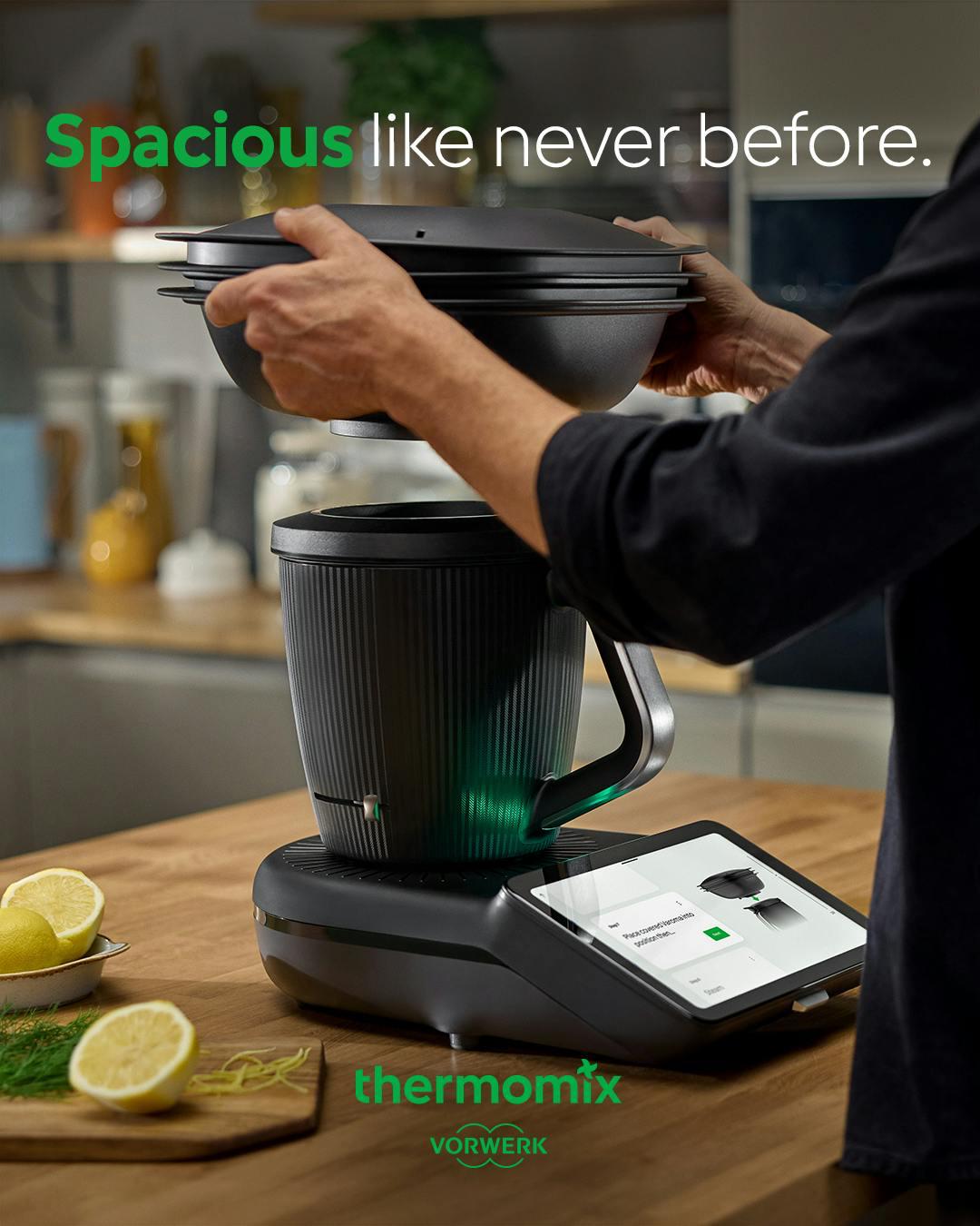 Thermomix TM7 on a kitchen counter with the Varoma being placed on top